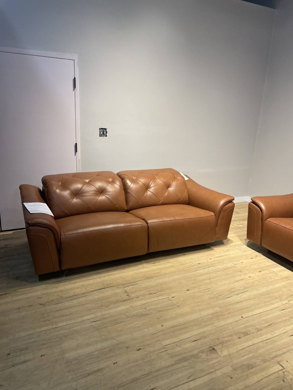 Carvel Leather Power Reclining Sofa with Power Headrest Brown Set of Two